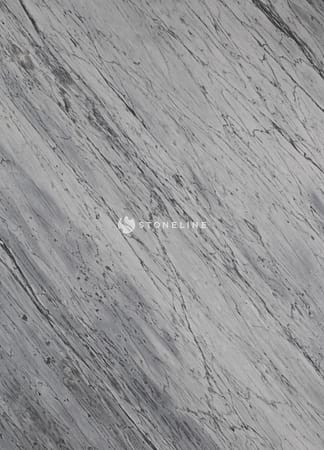 White and gray textured marble surface closeup.
