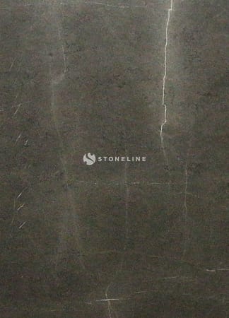 Close-up of black marble surface with veins.