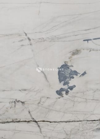 Close-up of smooth gray marble surface with veins.