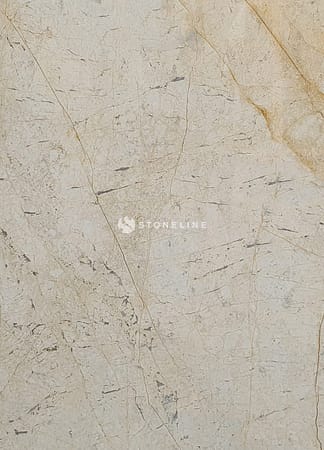 Close-up of beige textured marble surface.