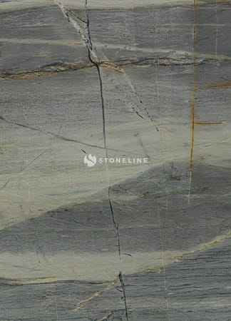 Close-up of natural gray stone texture with veins.