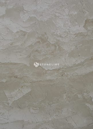 Close-up of textured beige stone surface