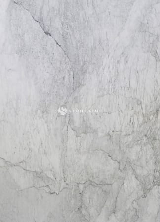 Close-up of white marble texture with veins.