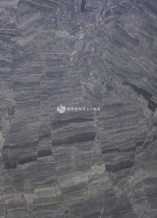 Close-up of gray stone texture with layers.