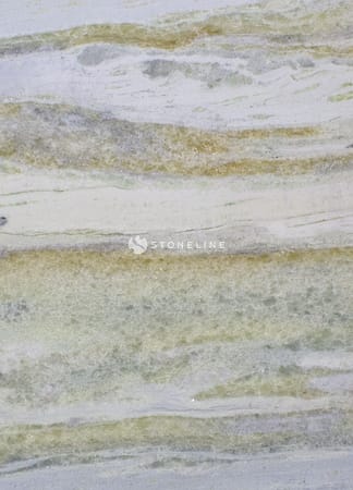 Close-up of textured stone surface with greenish hues.