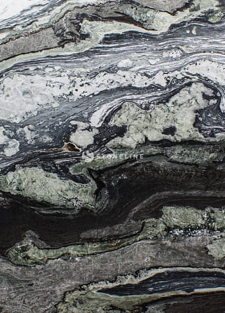 Close-up of textured black and white rock surface.