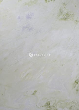 Textured pale green marble surface