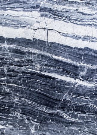 Close-up of textured gray and white marble surface.