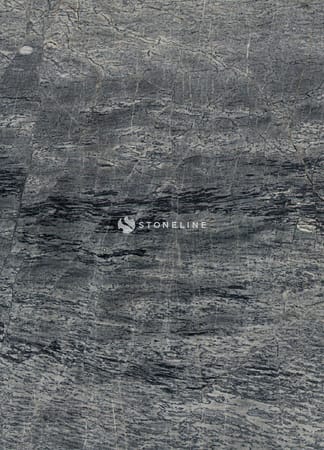 Gray textured marble stone surface with natural patterns.