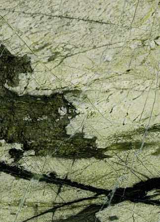 Close-up of green and white natural stone texture.