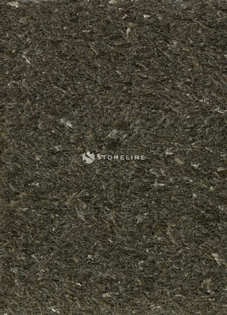 Close-up of dark textured rock surface