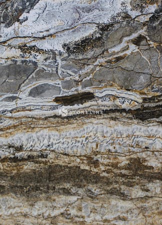 Close-up of textured stone surface with layers.
