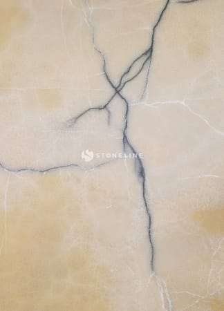 Close-up of beige marble texture with veins