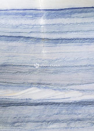 Close-up of polished marble with dark streaks