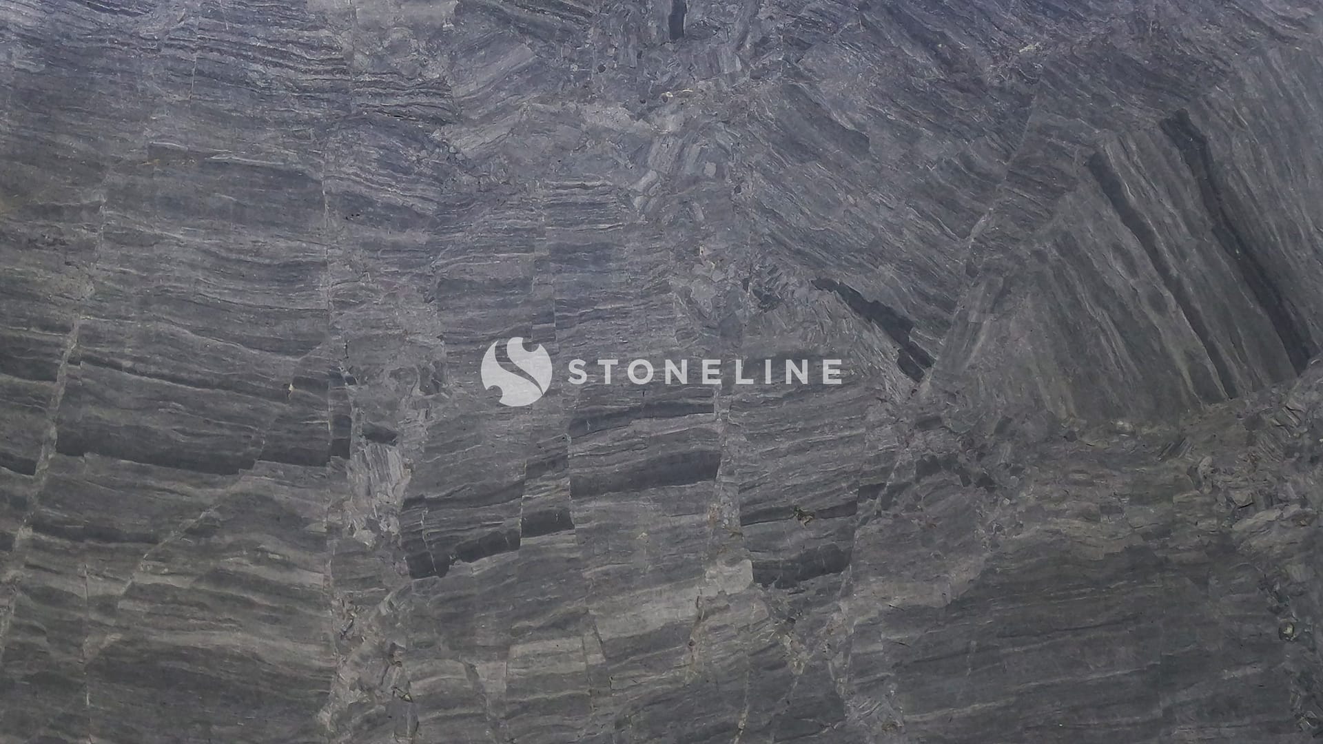 Close-up of gray stone texture with layers.