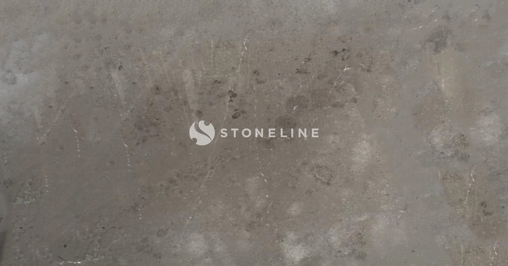 Weathered concrete wall with textured surface.