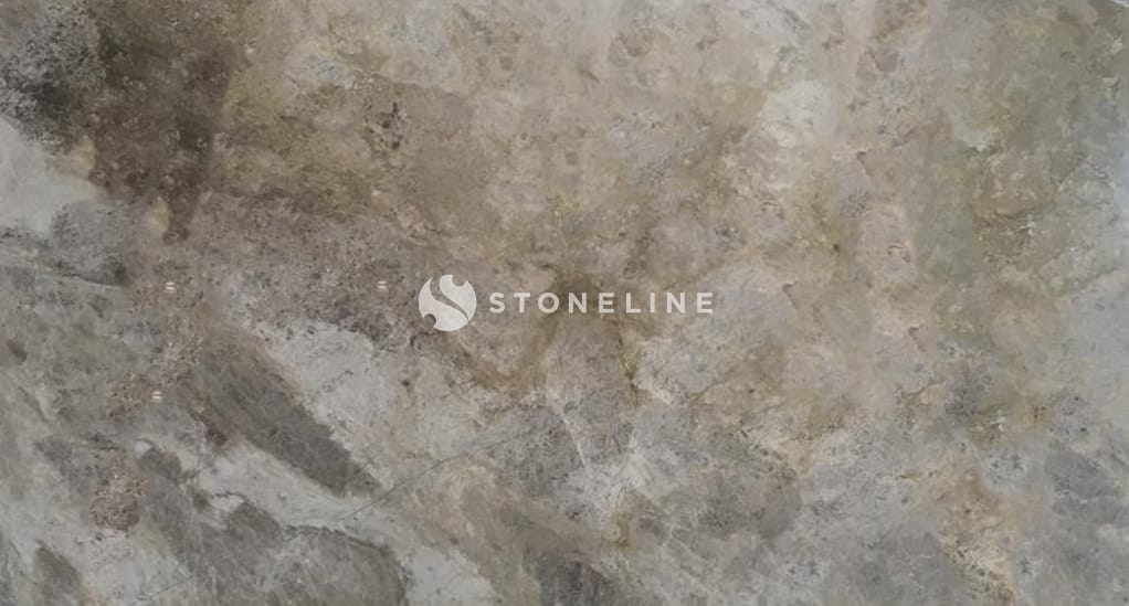 Close-up of textured stone surface with earthy tones.