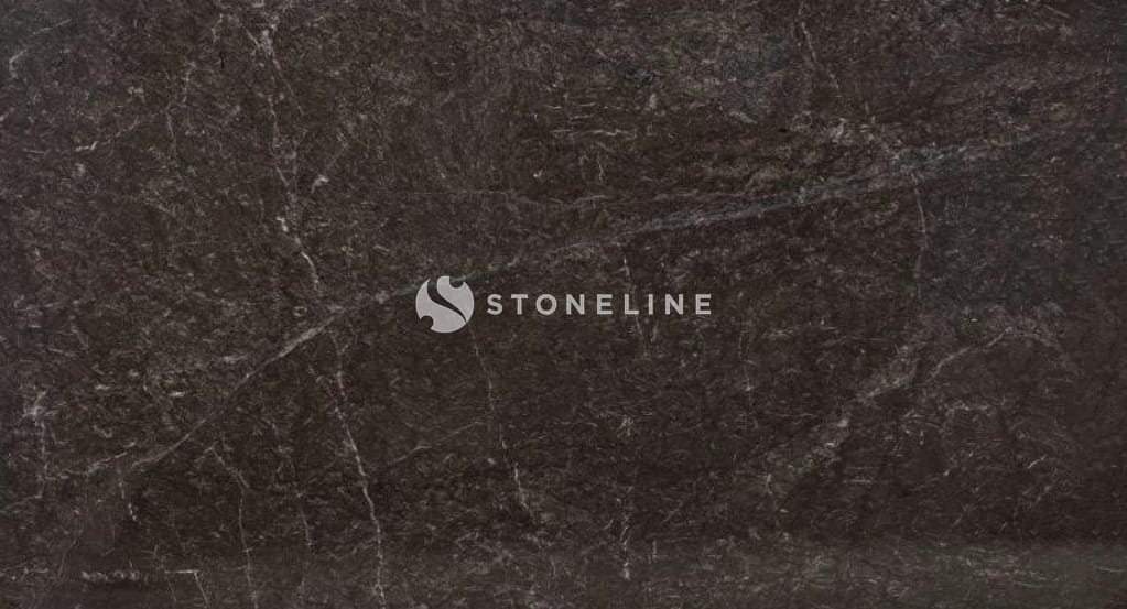 Close-up of dark brown marble surface.
