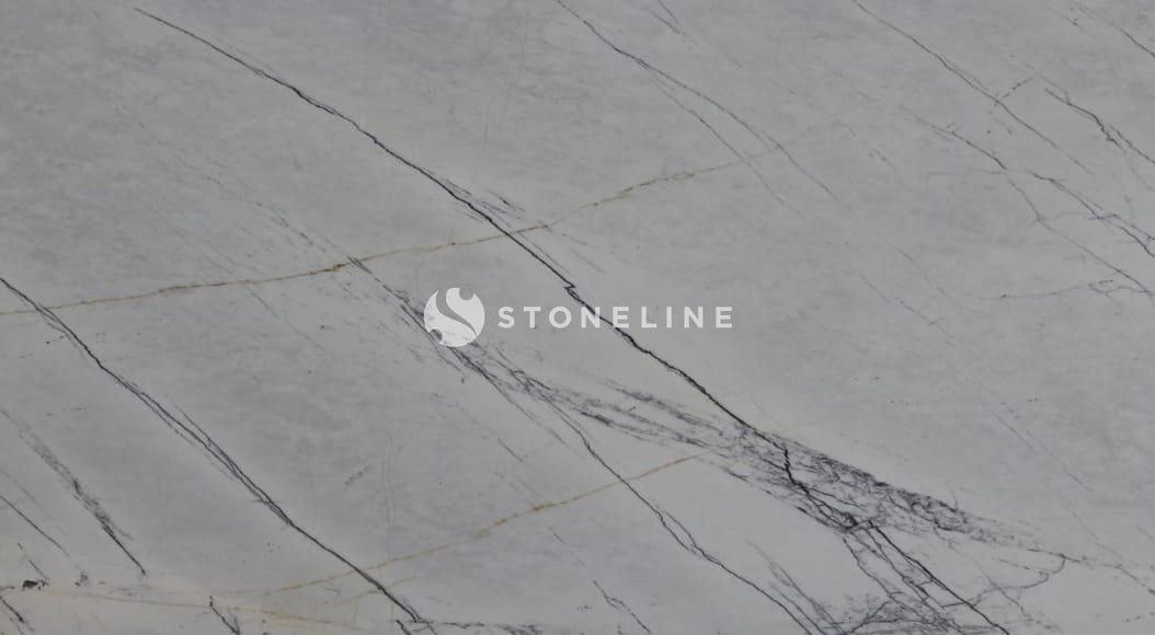 Close-up of gray marble surface with veins.