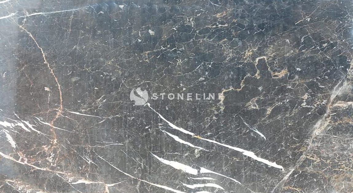 Dark marble surface with white veins.