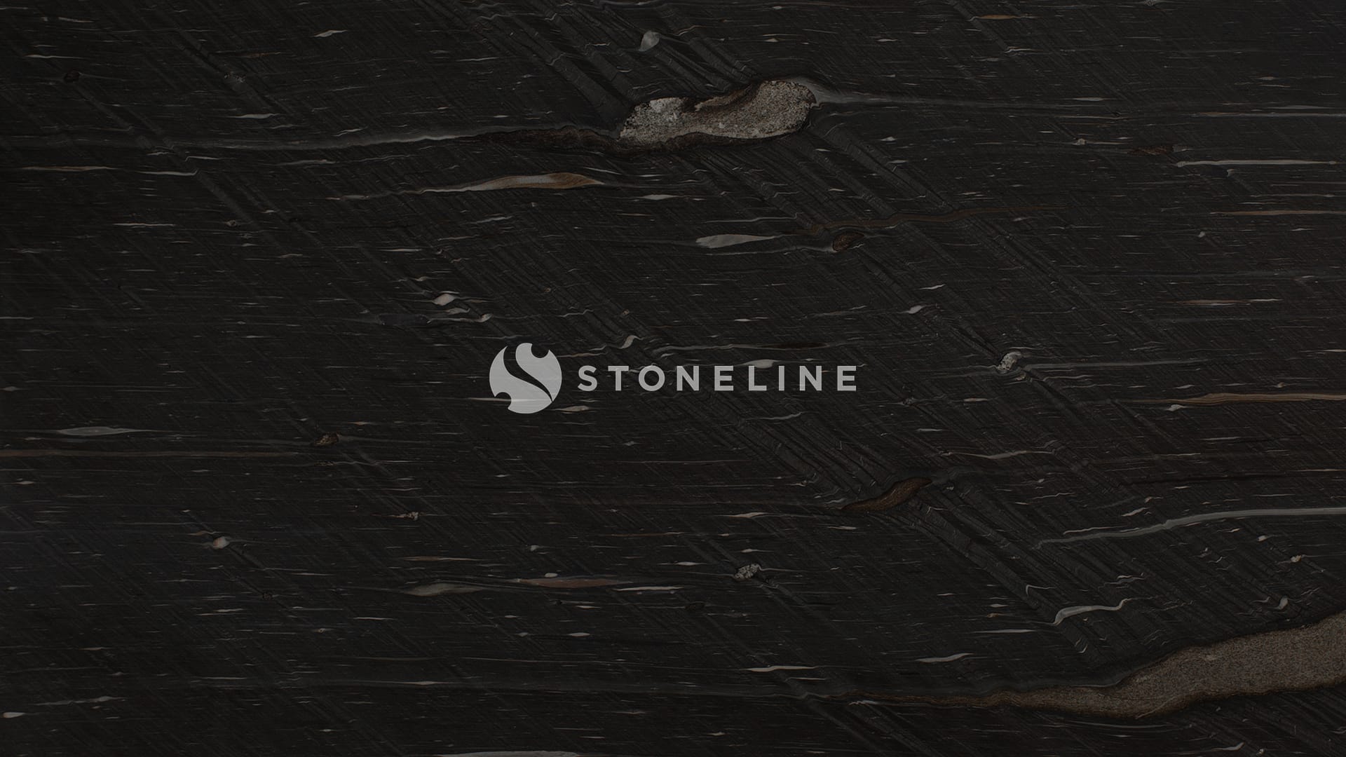 Dark textured stone surface, close-up view.