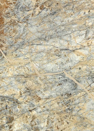 Close-up of multicolored marble texture with veins.
