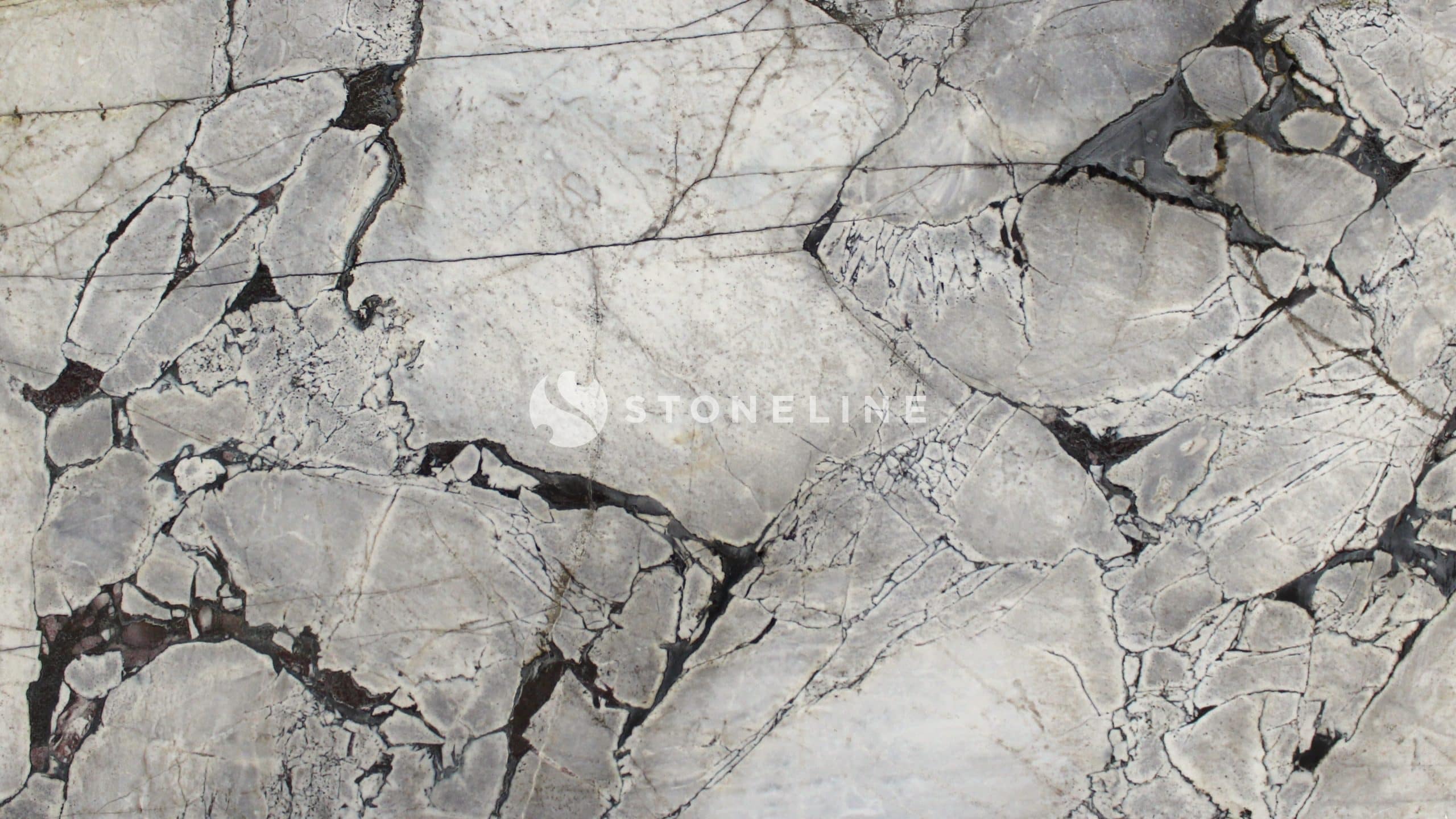 Close-up of cracked, textured gray marble.