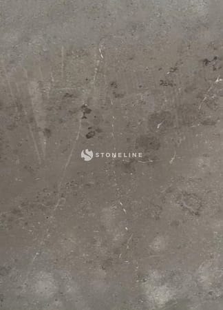 Weathered concrete wall with textured surface.