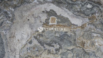 Close-up of textured gray and brown stone surface.