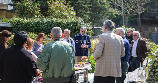 Group outdoors enjoying food and conversation