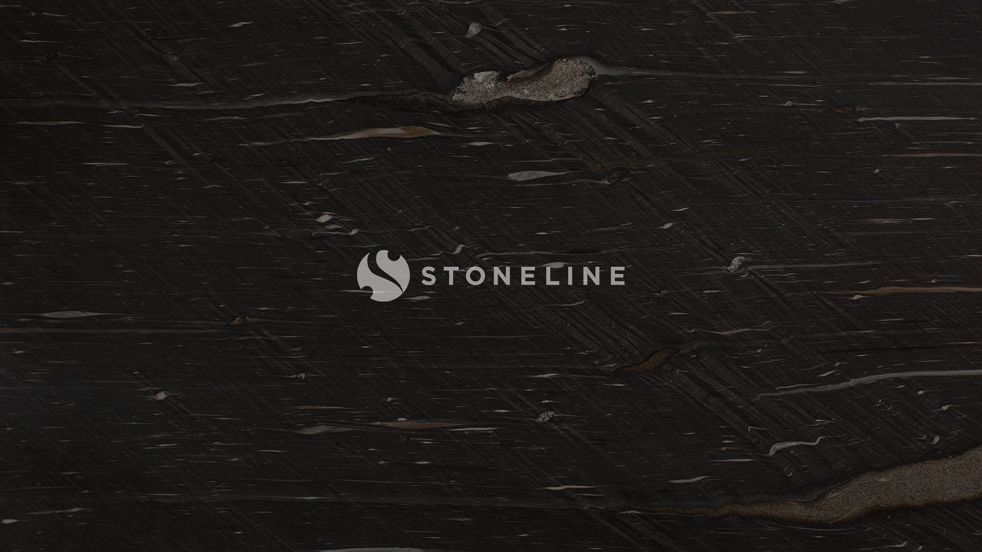 Dark textured stone surface, close-up view.