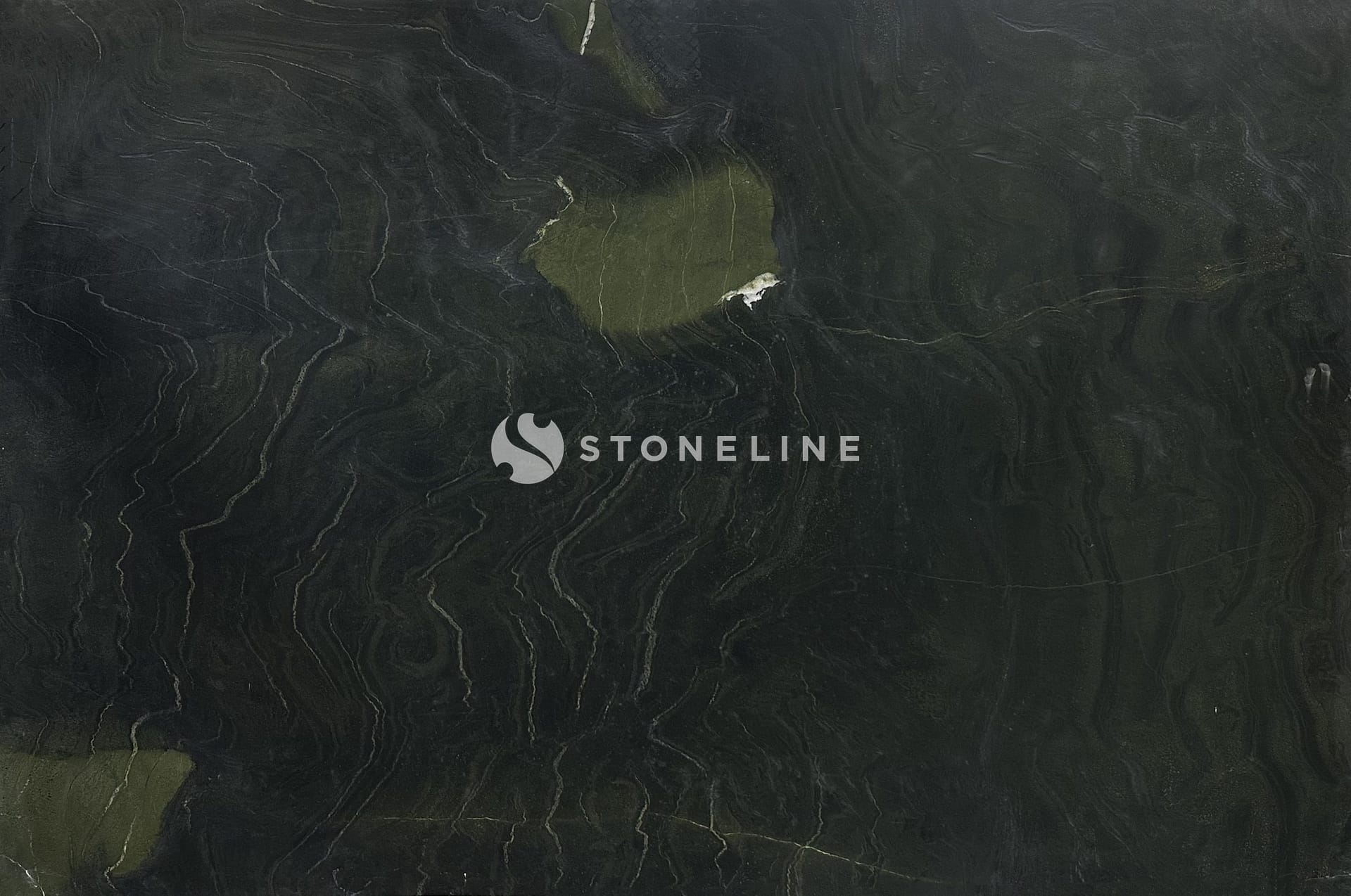 Dark textured stone surface with greenish hues.