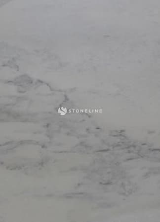 Close-up of light gray stone texture surface.