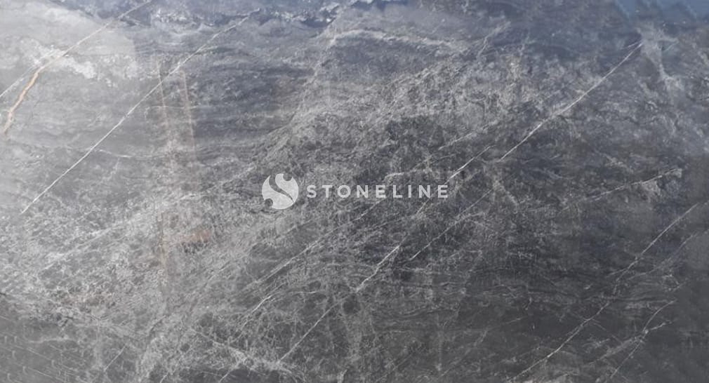 Close-up of textured gray stone surface.