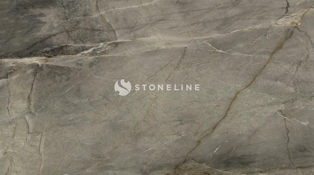 Gray marble surface with natural veins and patterns.