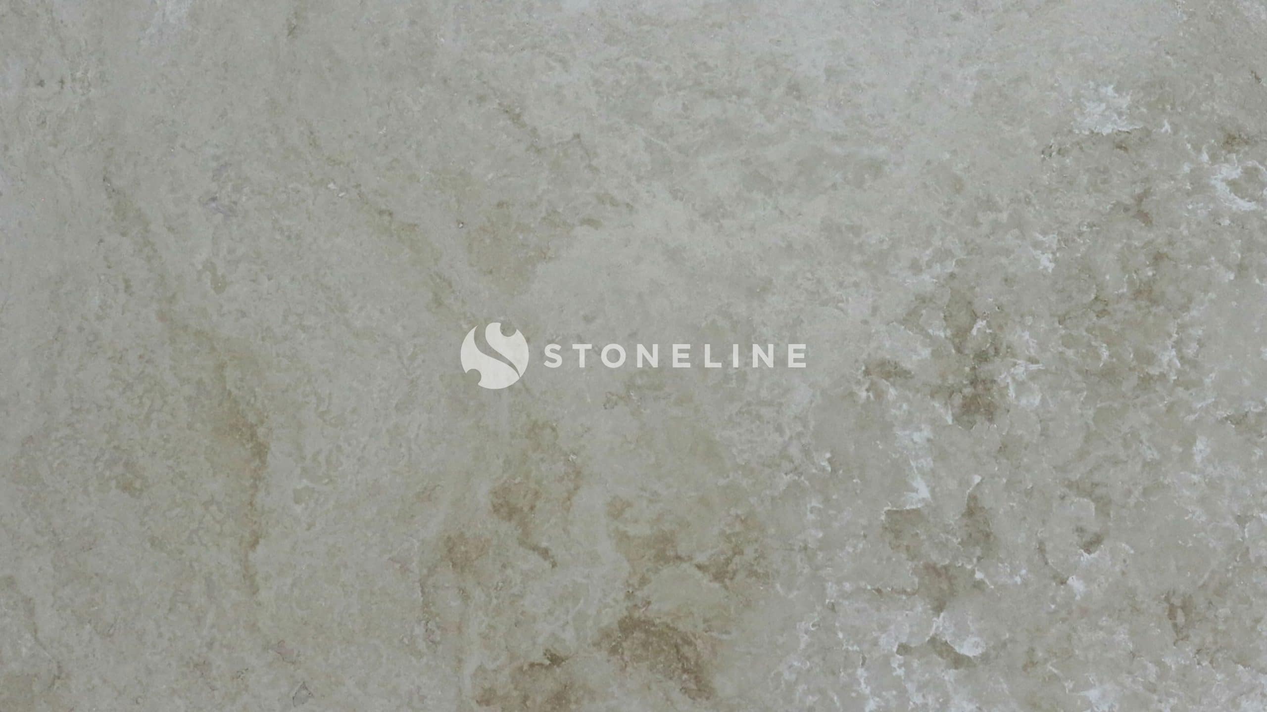 Textured beige marble surface detail.