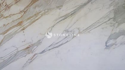 Polished white marble surface with natural veining.