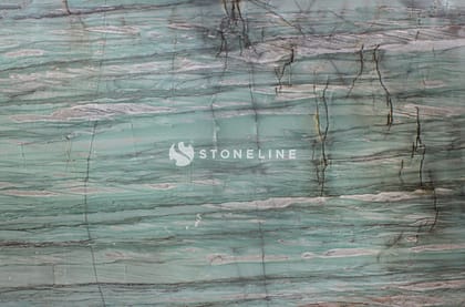 Close-up of marble surface with teal and gray veins.