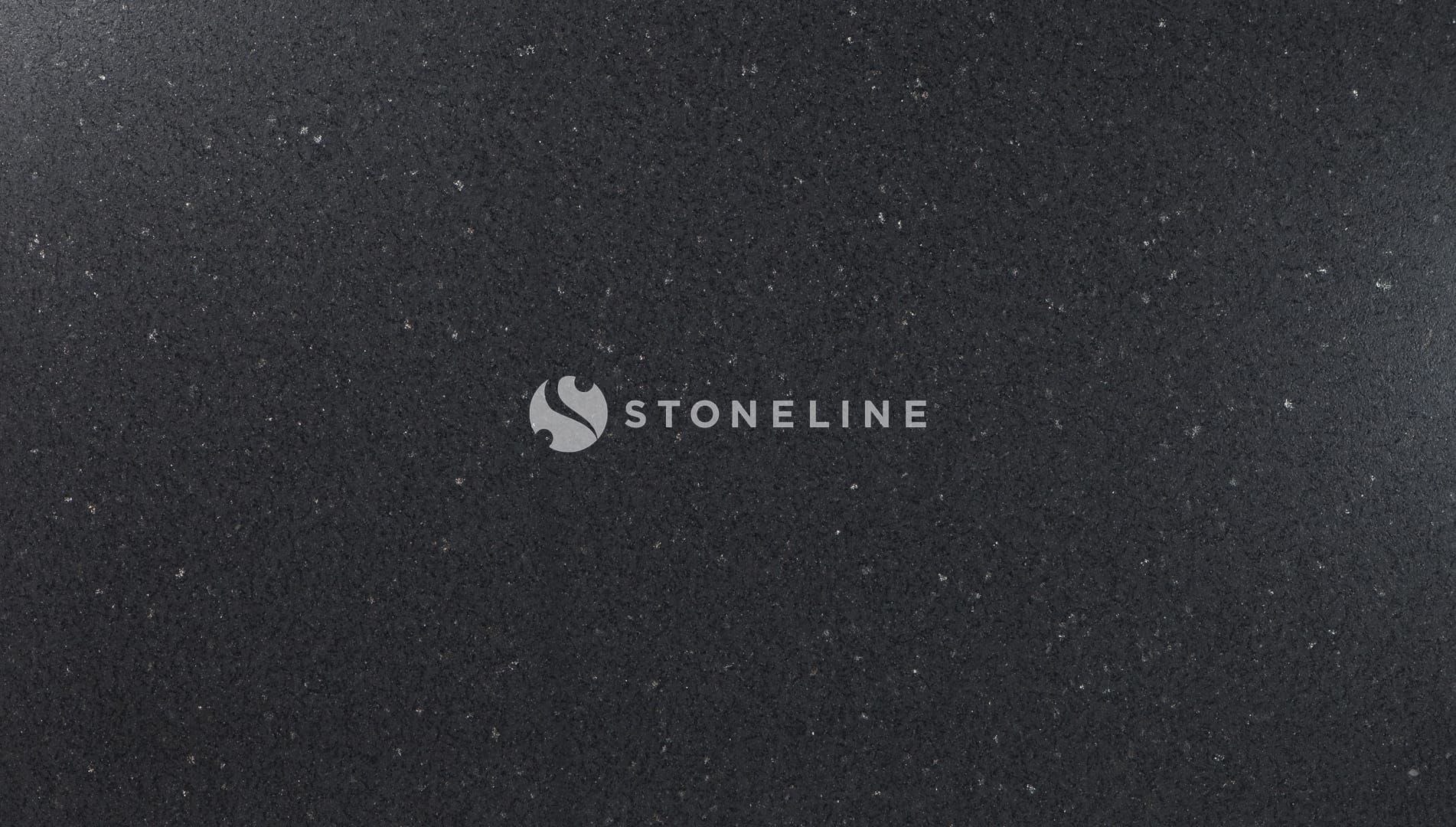 Close-up of black granite surface with speckles.