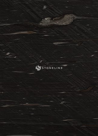 Dark textured stone surface, close-up view.