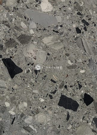 Close-up of gray marble texture with black specks.