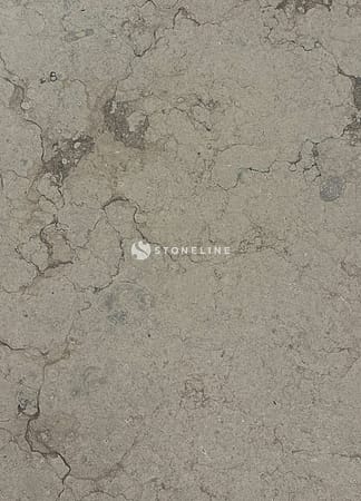 Close-up of cracked, weathered stone surface texture.