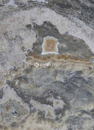 Close-up of textured gray and brown stone surface.