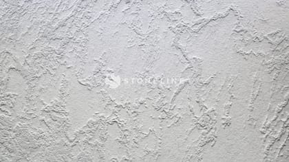 Textured white plaster wall surface close-up