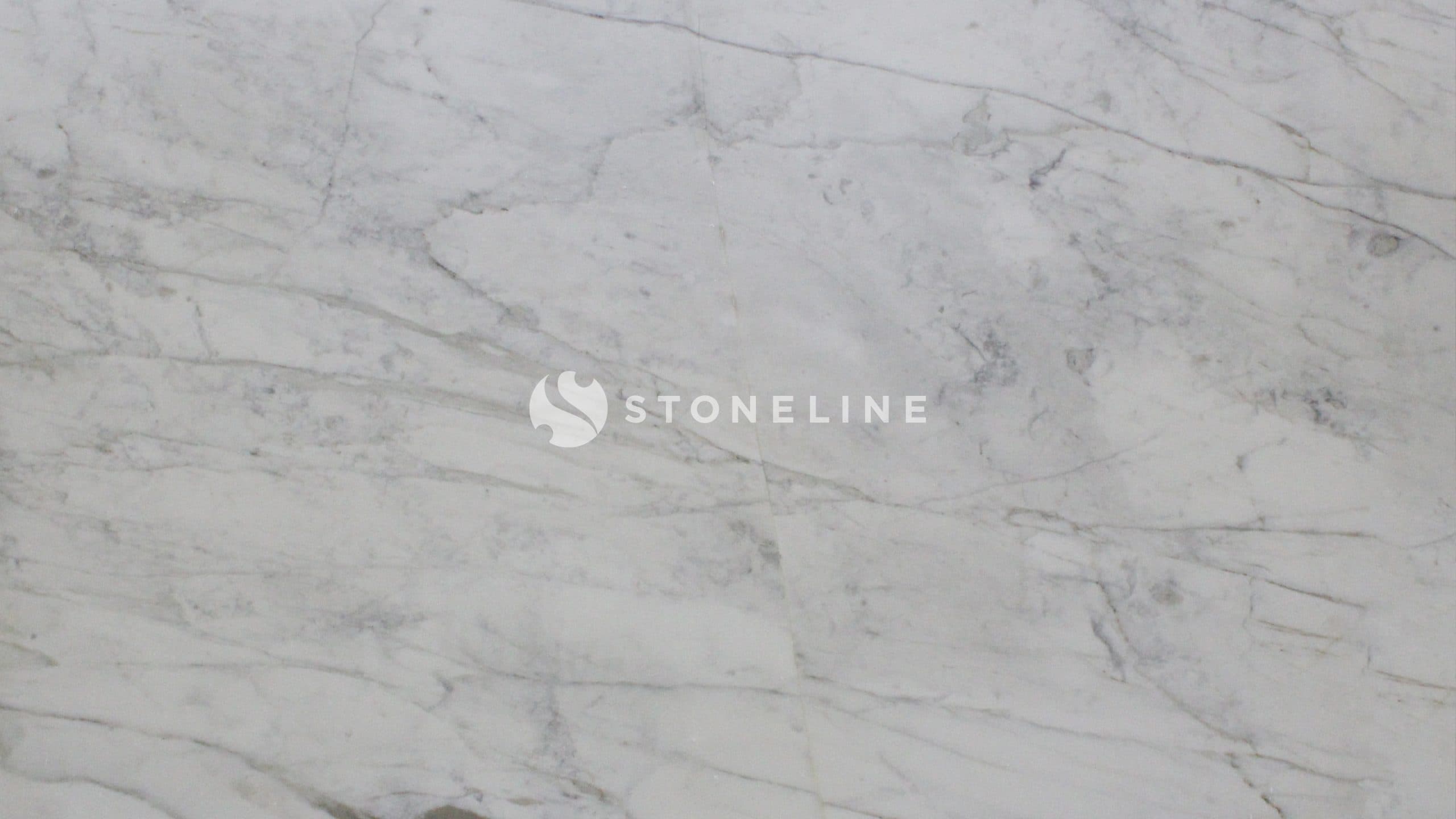 Close-up of white marble surface with veins