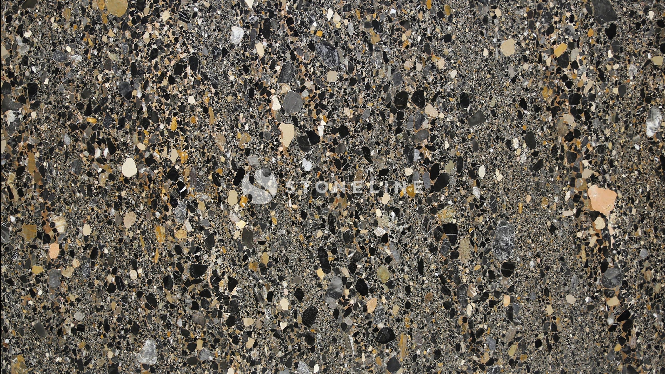 Close-up of textured stone surface in various colors.