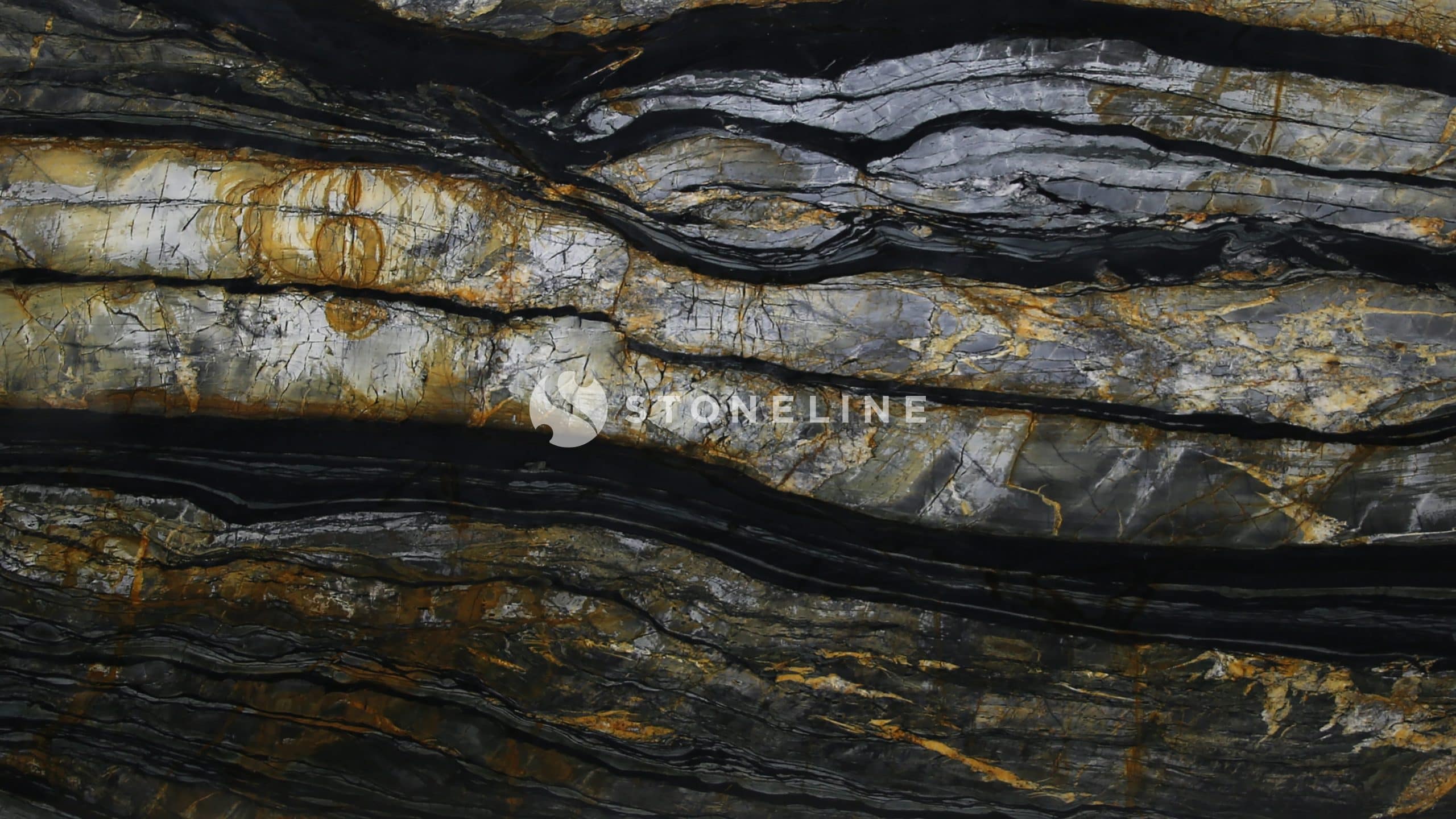 Close-up of textured, multicolored rock surface