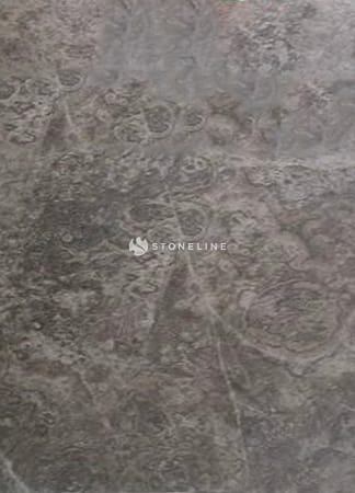 Rough marble surface with visible textures and patterns.