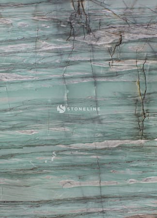 Close-up of marble surface with teal and gray veins.