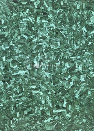 Textured green malachite gemstone surface background